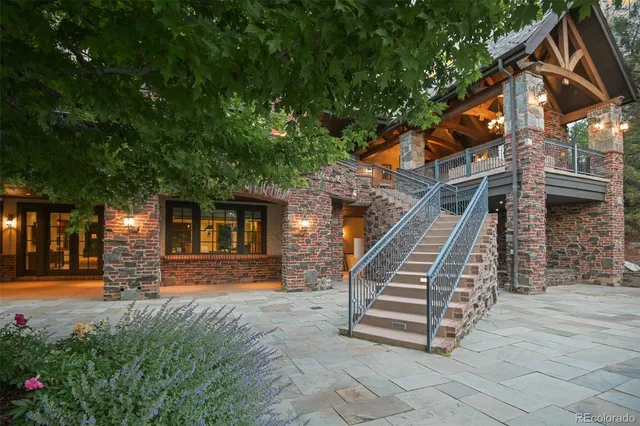 a front view of a house with stairs yard