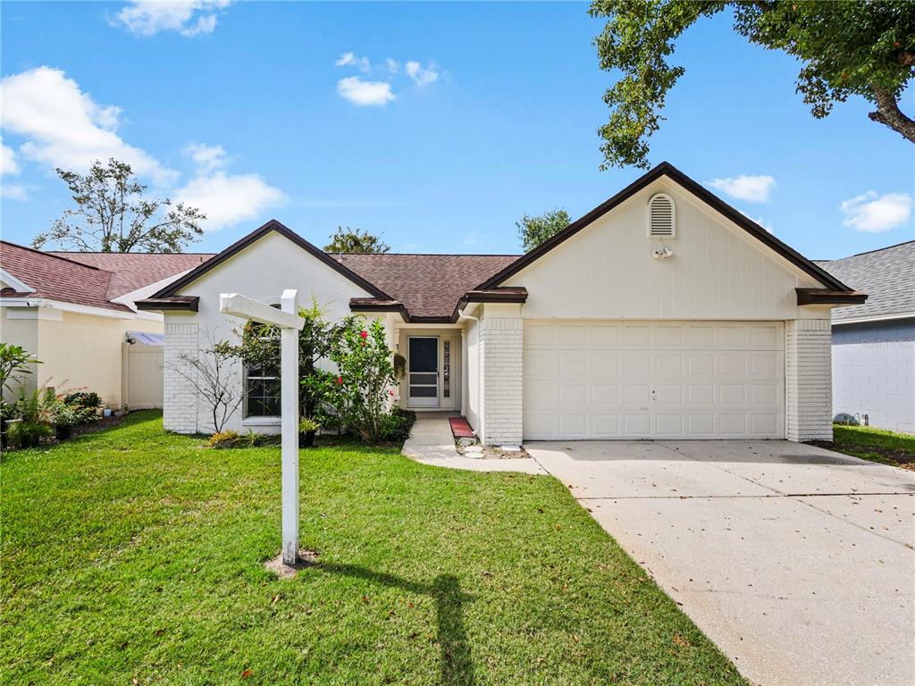 673 Whitetail Loop Apopka, FL 32703 - Photo 1 of 1 a view of a house with yard and tree s