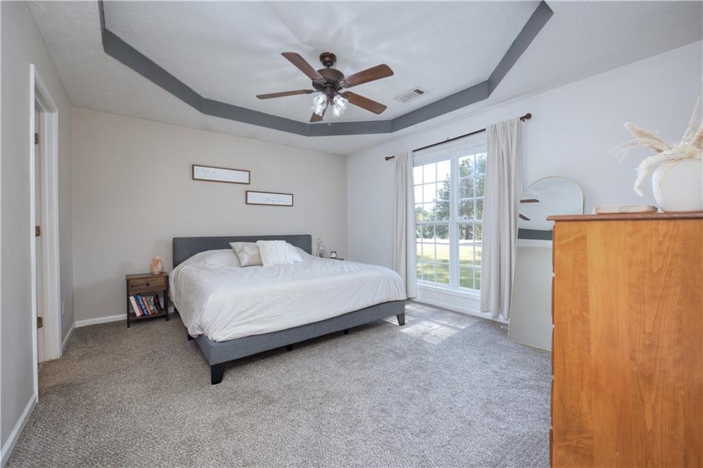 25 Lee Road Salem, AL 36874 - Photo 16 of 30 Carpeted bedroom featuring a raised ceiling and a ceiling fan