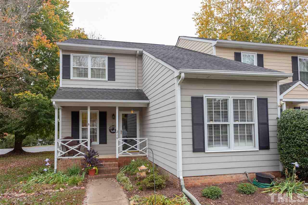 210 Bracken Court Raleigh, NC 27615 - Photo 1 of 26 a front view of a house with garden and porch