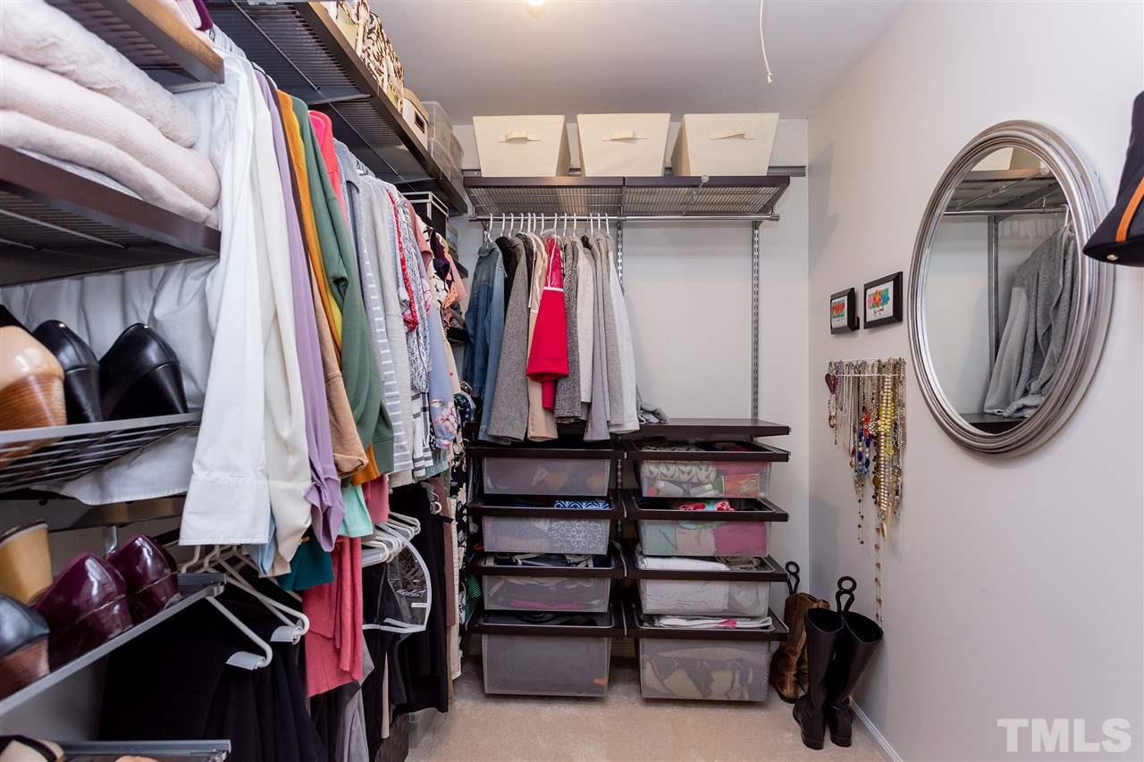 210 Bracken Court Raleigh, NC 27615 - Photo 20 of 26 a view of walk in closet with clothes and shoes
