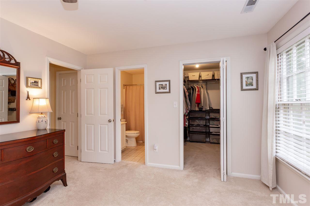 210 Bracken Court Raleigh, NC 27615 - Photo 22 of 26 a view of a bedroom with closet and cabinet