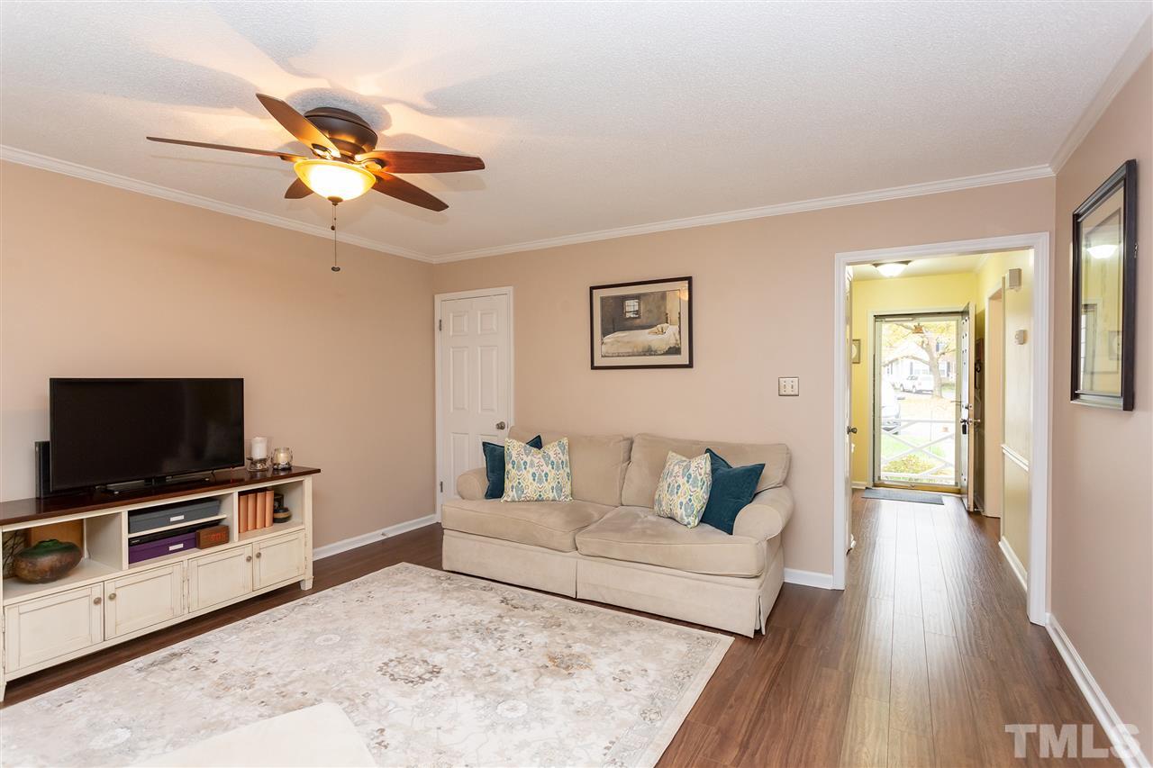 210 Bracken Court Raleigh, NC 27615 - Photo 7 of 26 a living room with furniture and a flat screen tv