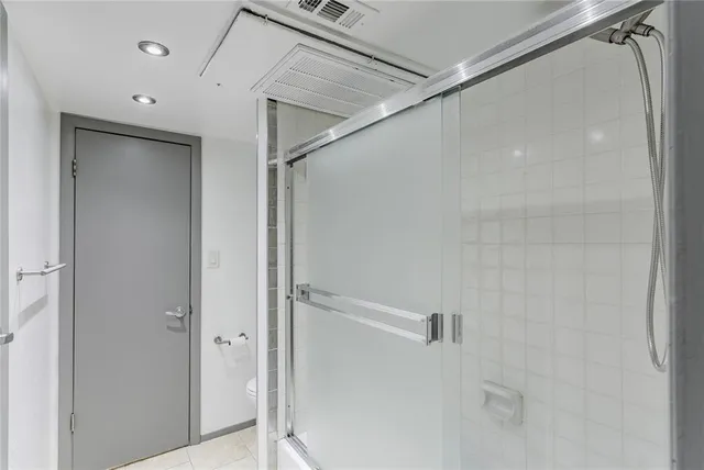 a bathroom with a shower and a toilet