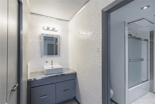 a view of a yard with plants and trees