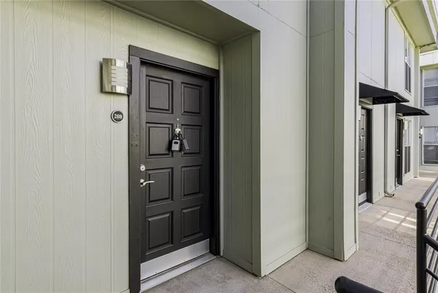 a view of an empty room and wooden floor