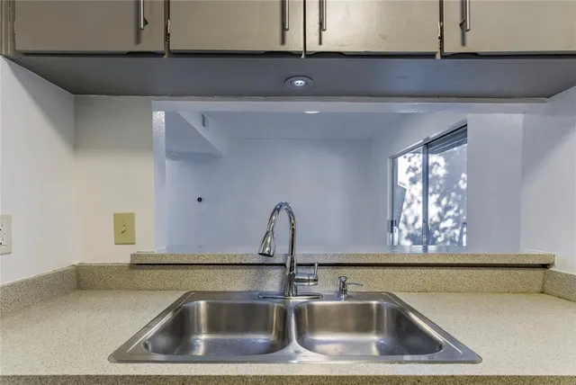 a stove top oven sitting inside of a kitchen