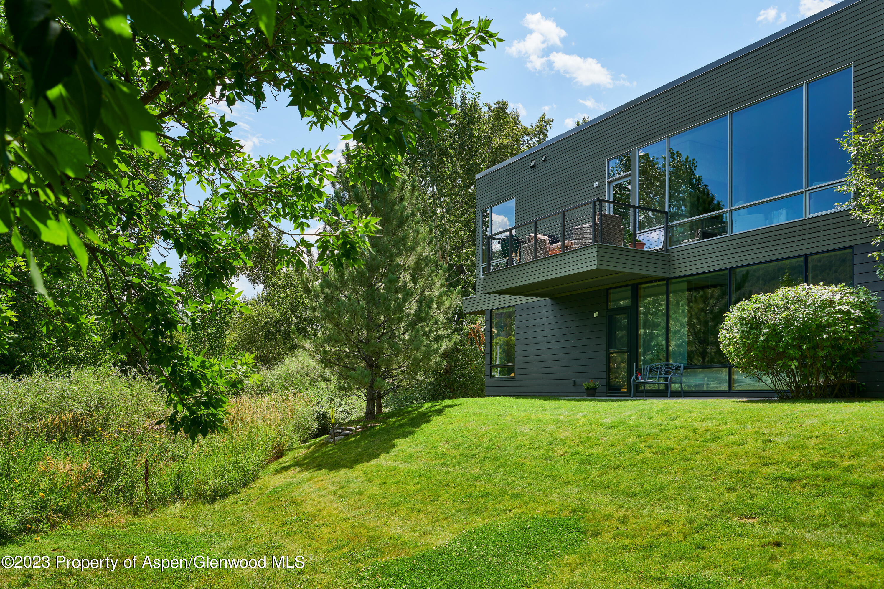 202 Evans Road, Unit 203 Basalt, CO 81621 - Photo 21 of 24 a front view of a house with a yard