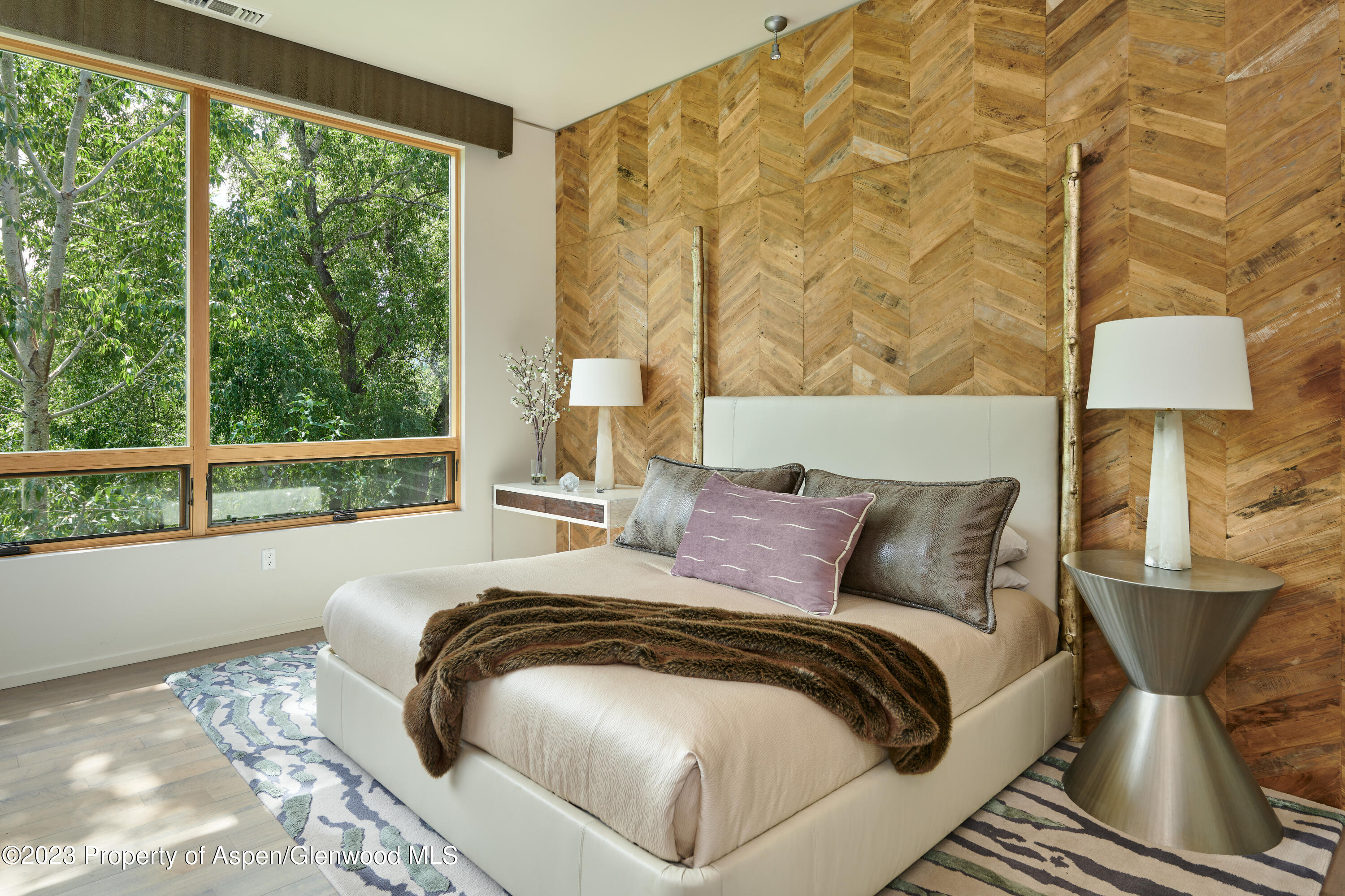 202 Evans Road, Unit 203 Basalt, CO 81621 - Photo 10 of 24 a bed sitting in a bedroom next to a window