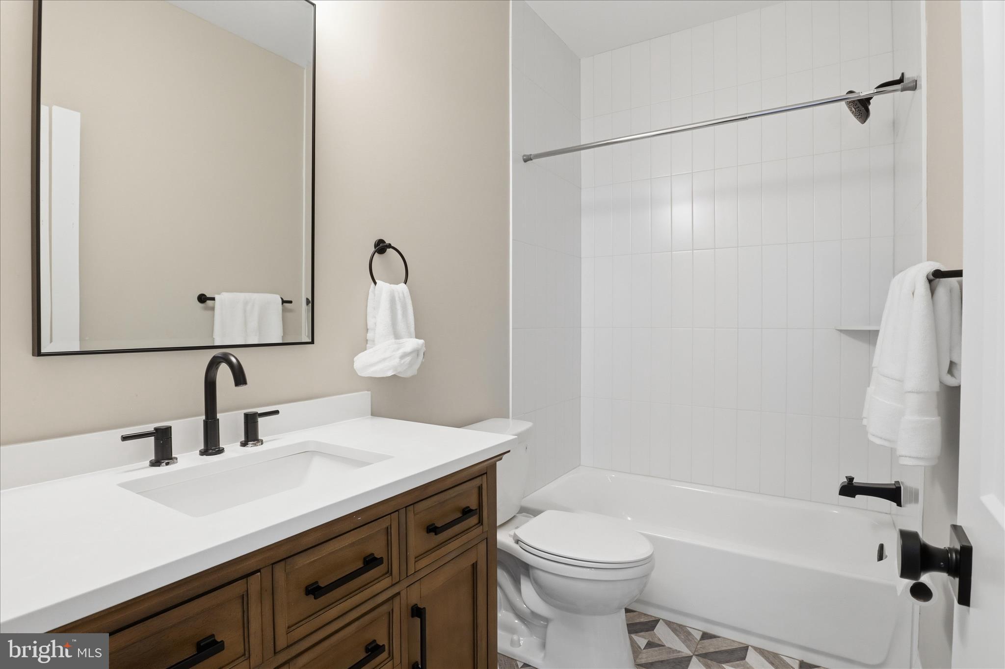 202 Branch Road Southeast Vienna, VA 22180 - Photo 37 of 59 a bathroom with a sink a toilet and a bathtub