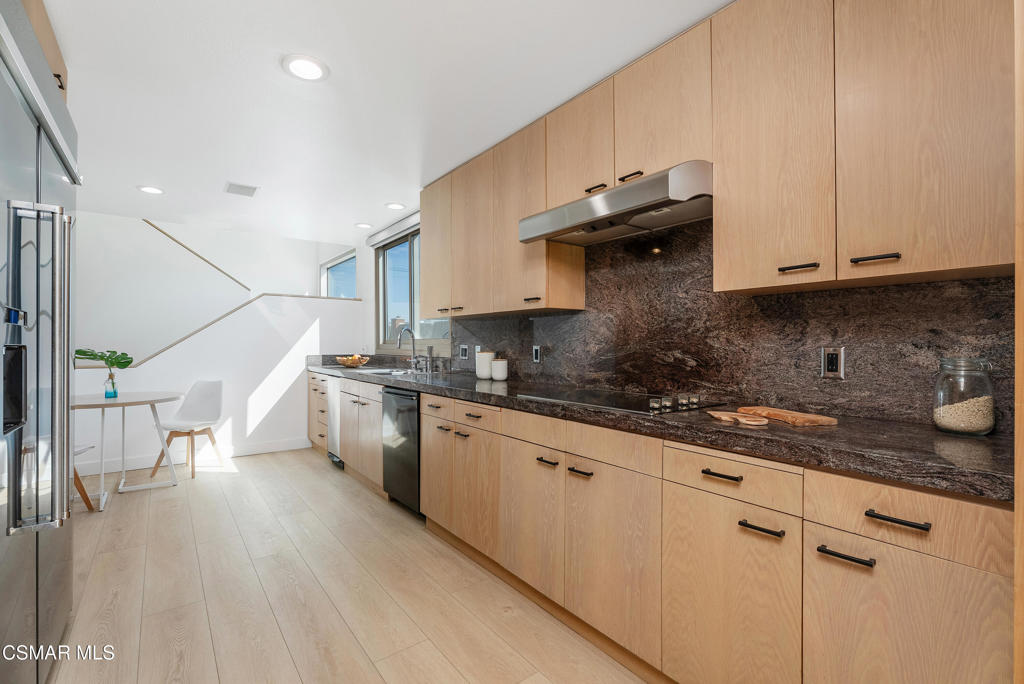 4 Jib Street, Unit 13 Marina del Rey, CA 90292 - Photo 13 of 53 a kitchen with a sink a stove and cabinets