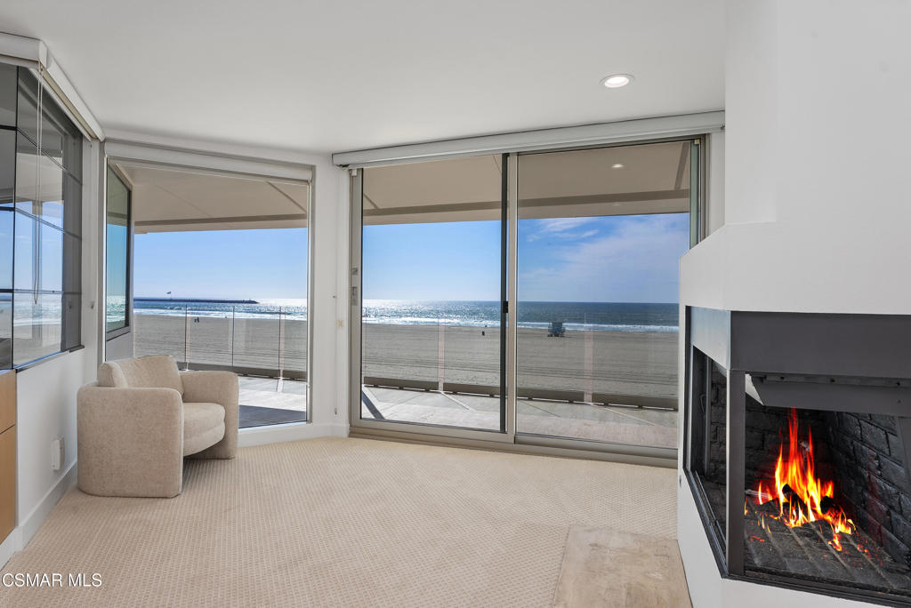 4 Jib Street, Unit 13 Marina del Rey, CA 90292 - Photo 24 of 53 a living room with furniture and a floor to ceiling window