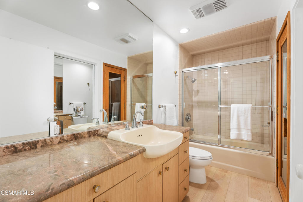 4 Jib Street, Unit 13 Marina del Rey, CA 90292 - Photo 36 of 53 a bathroom with a granite countertop sink mirror vanity bathtub and toilet