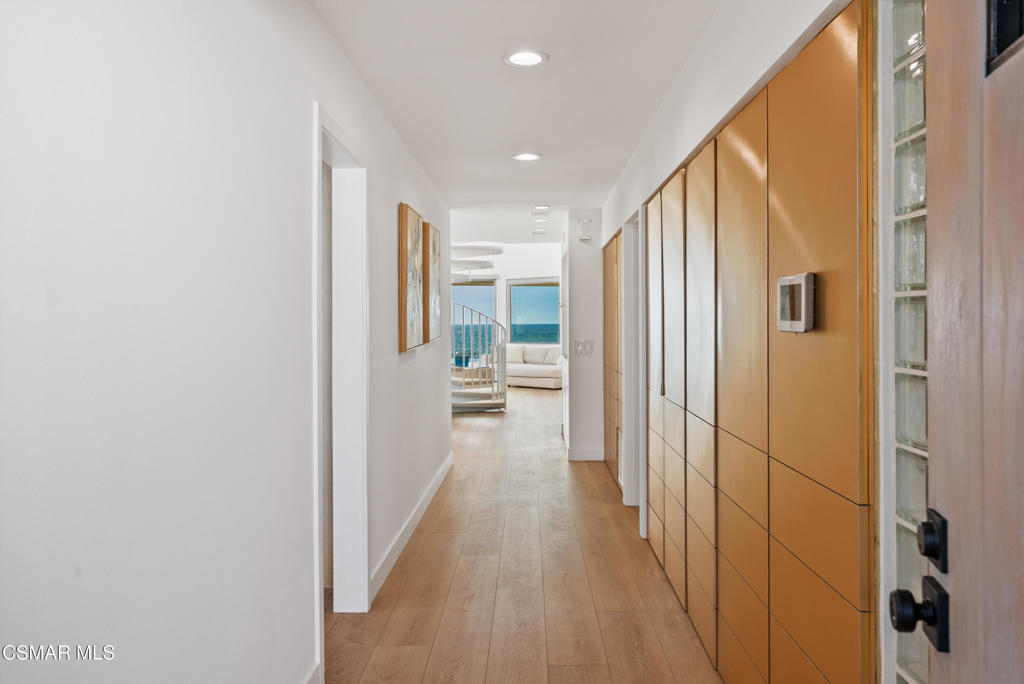 4 Jib Street, Unit 13 Marina del Rey, CA 90292 - Photo 7 of 53 a view of a hallway with wooden shelves