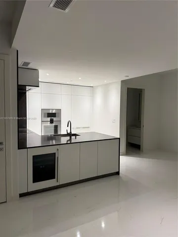 a view of barbeque area with outdoor seating