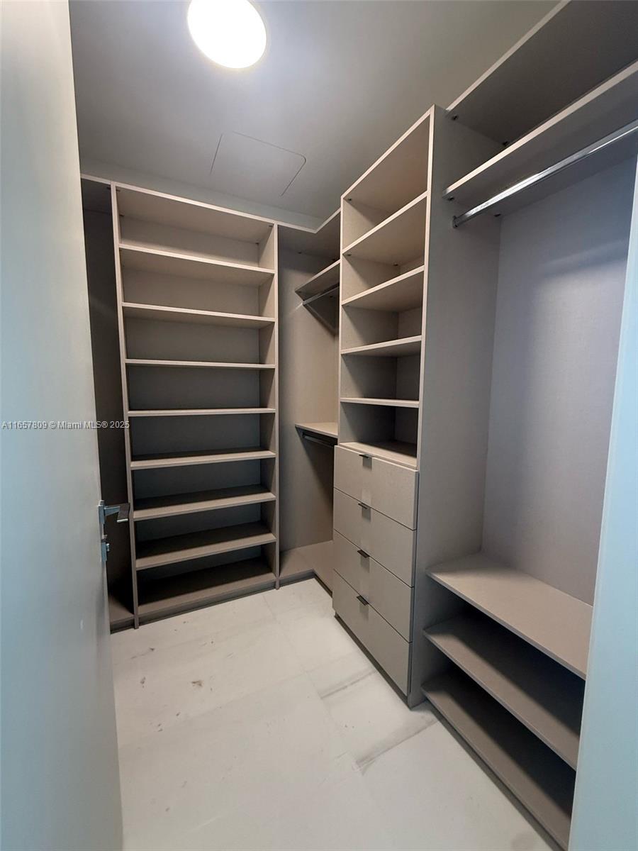 300 Biscayne Blvd Way, Unit 1909 Miami, FL 33131 - Photo 38 of 42 a view of walk in closet with empty racks