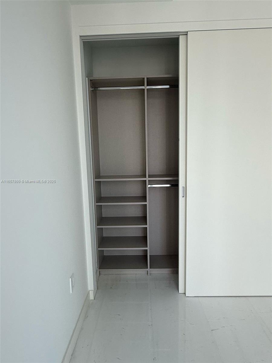 300 Biscayne Blvd Way, Unit 1909 Miami, FL 33131 - Photo 42 of 42 a view of walk in closet with empty racks