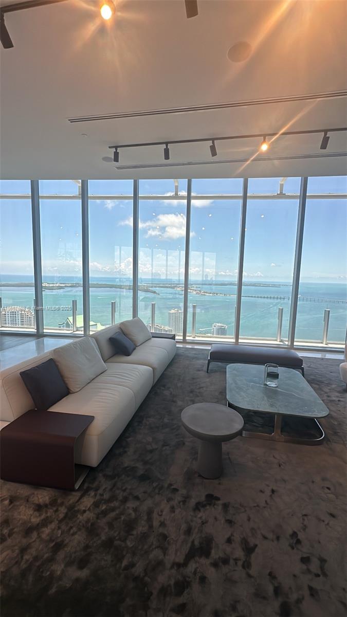 300 Biscayne Blvd Way, Unit 1909 Miami, FL 33131 - Photo 6 of 42 a living room with furniture and a floor to ceiling window