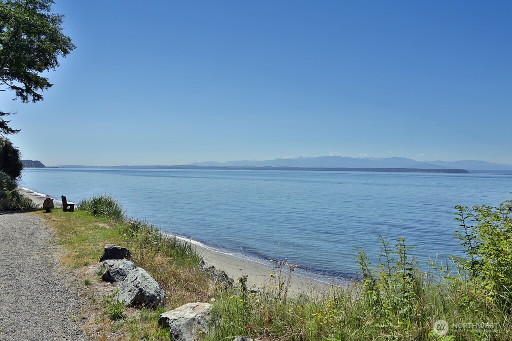 364 Gramayre Road Coupeville, WA 98239 - Photo 18 of 38 a view of a lake with a yard