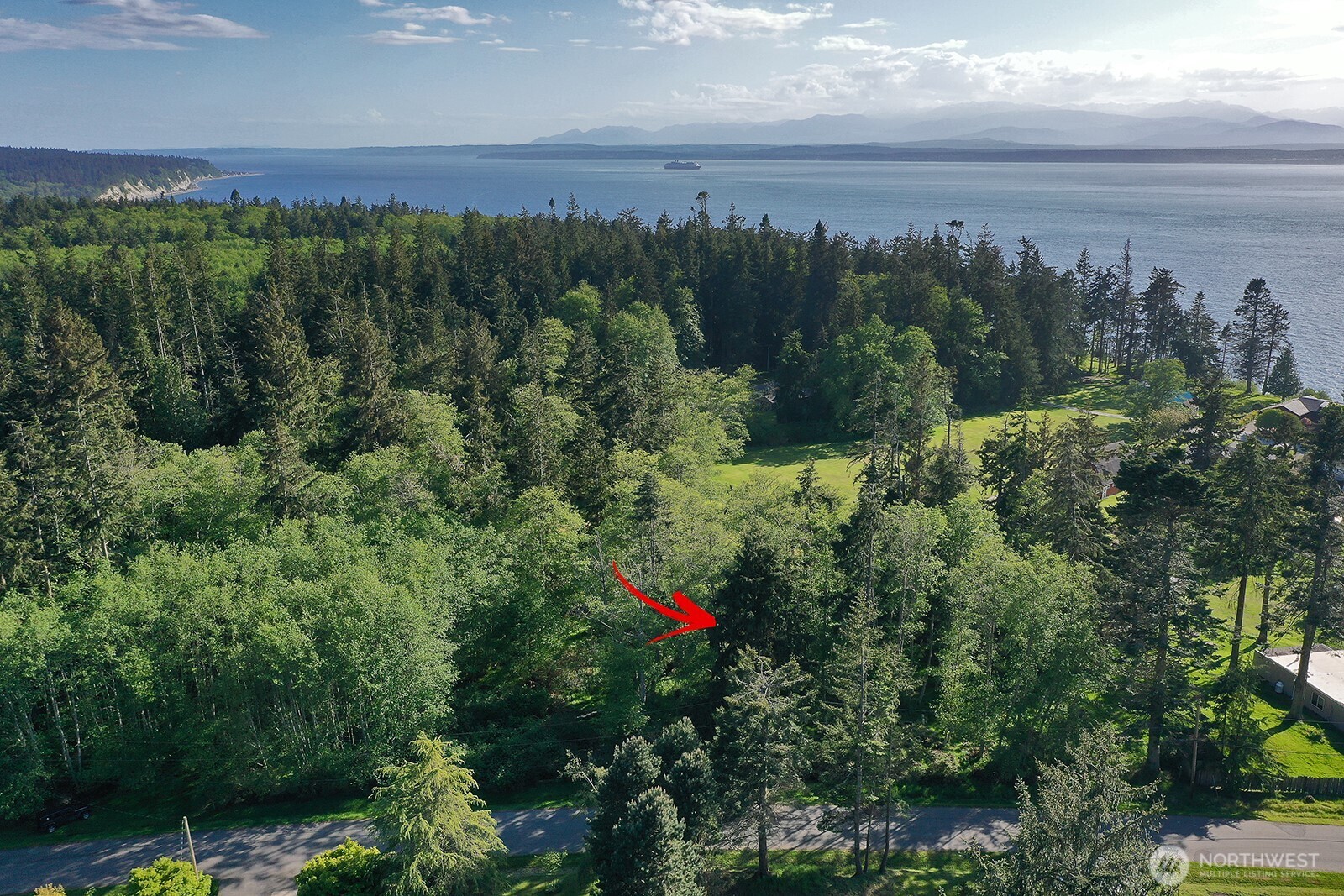364 Gramayre Road Coupeville, WA 98239 - Photo 30 of 38 a view of a city and a mountain view in middle