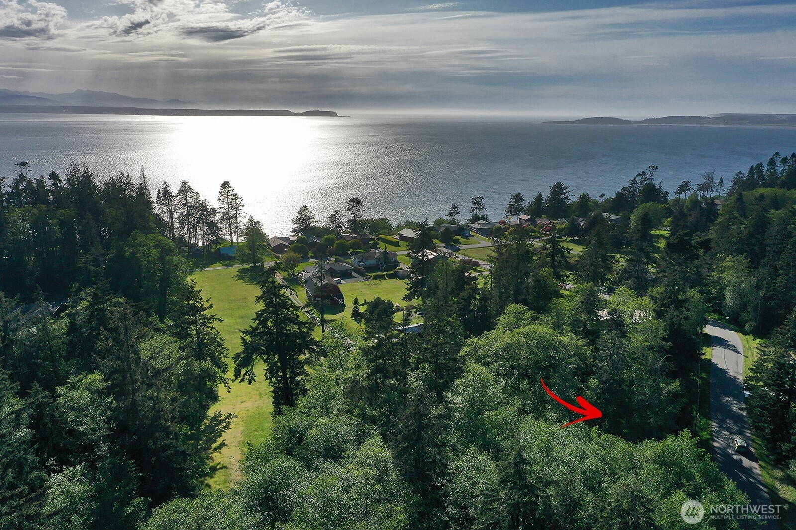 364 Gramayre Road Coupeville, WA 98239 - Photo 34 of 38 a view of a lake from a yard
