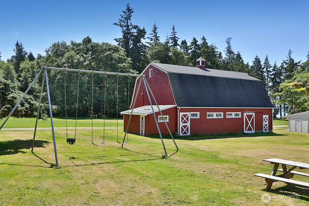 364 Gramayre Road Coupeville, WA 98239 - Photo 5 of 38 a view of a park with swings and a park