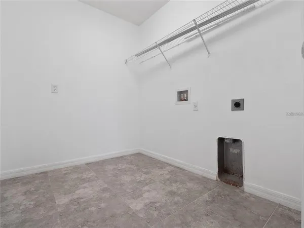 a view of house with backyard outdoor space and outdoor view