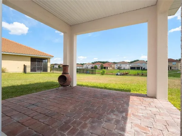 an aerial view of a house with outdoor space