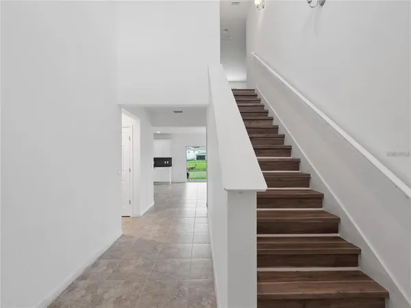 a view of an entryway with wooden floor