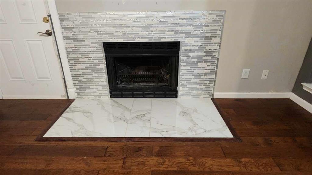 4101 Esters Road, Unit 111 Irving, TX 75038 - Photo 11 of 34 a living room with a fireplace