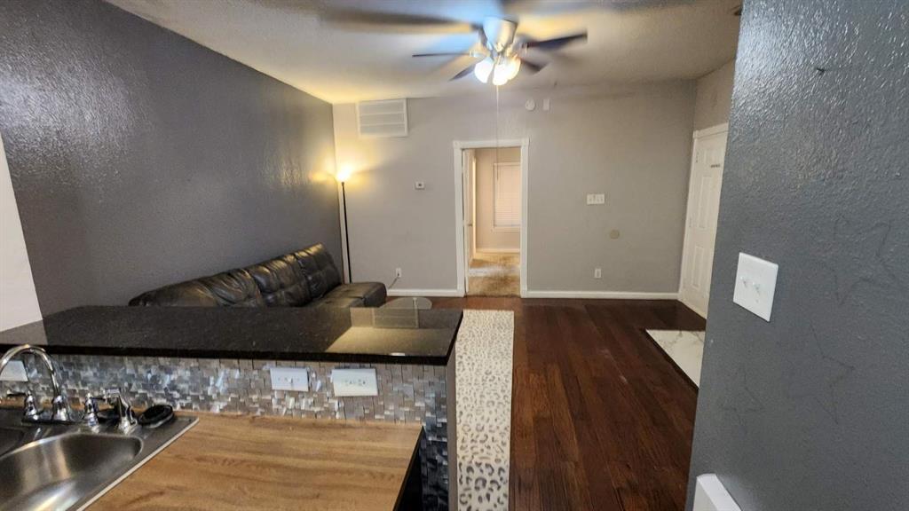 4101 Esters Road, Unit 111 Irving, TX 75038 - Photo 12 of 34 a living room with furniture and a rug