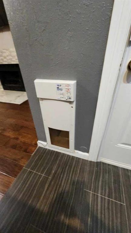 4101 Esters Road, Unit 111 Irving, TX 75038 - Photo 18 of 34 a view of an empty room with wooden floor and a fireplace