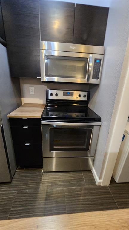 4101 Esters Road, Unit 111 Irving, TX 75038 - Photo 19 of 34 a stove top oven sitting inside of a kitchen