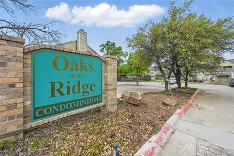 4101 Esters Road, Unit 111 Irving, TX 75038 - Photo 2 of 34 a sign on the side of a building