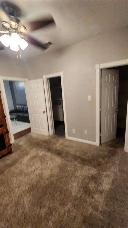 4101 Esters Road, Unit 111 Irving, TX 75038 - Photo 23 of 34 en empty room with windows and ceiling fan