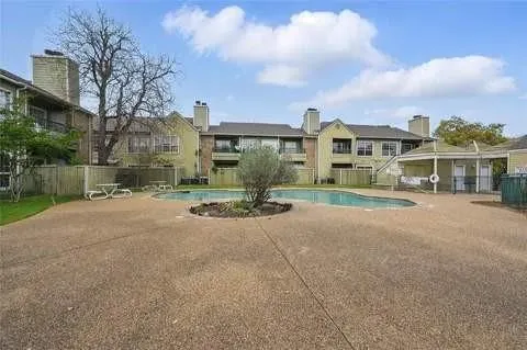 a view of house with a yard