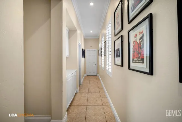 a view of a hallway with paintings on the walls