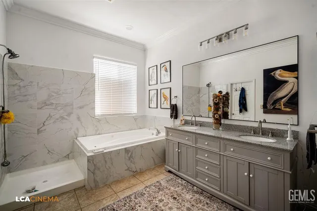 a bathroom with a tub a sink and mirror