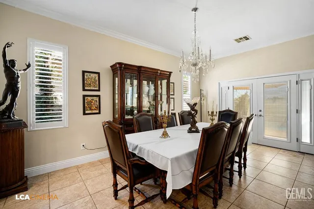 a view of a dining room with furniture and window