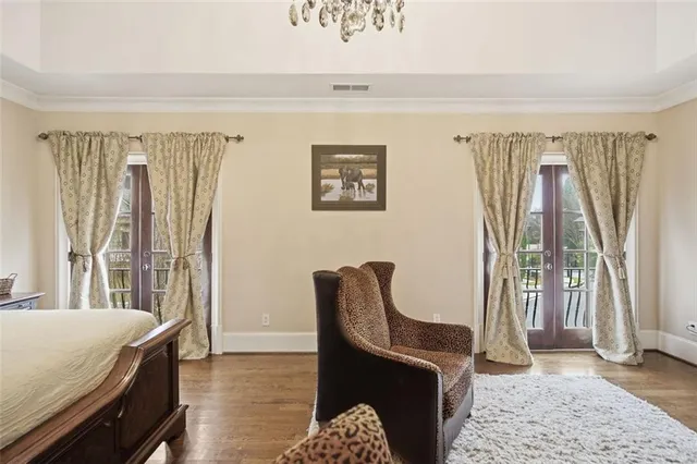 a bedroom with furniture and a window