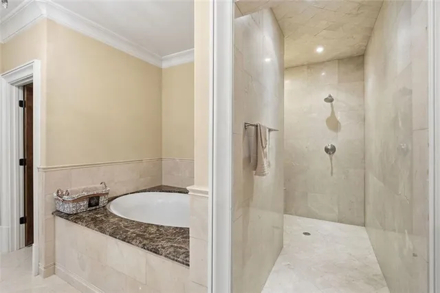 a bathroom with a granite countertop sink a toilet and shower