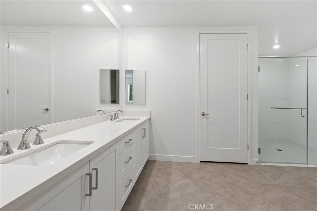 4200 Rivington Irvine, CA 92612 - Photo 11 of 11 a bathroom with a double vanity sink and mirror