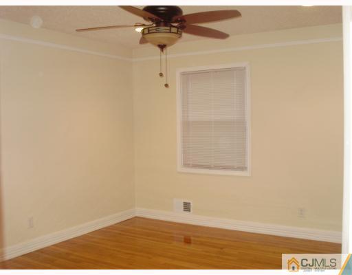 33 Brandeis Road Old Bridge, NJ 08859 - Photo 6 of 10 an empty room with a window