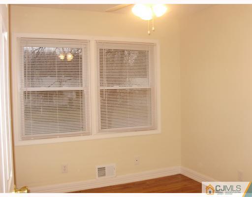 33 Brandeis Road Old Bridge, NJ 08859 - Photo 7 of 10 a view of an empty room with a window