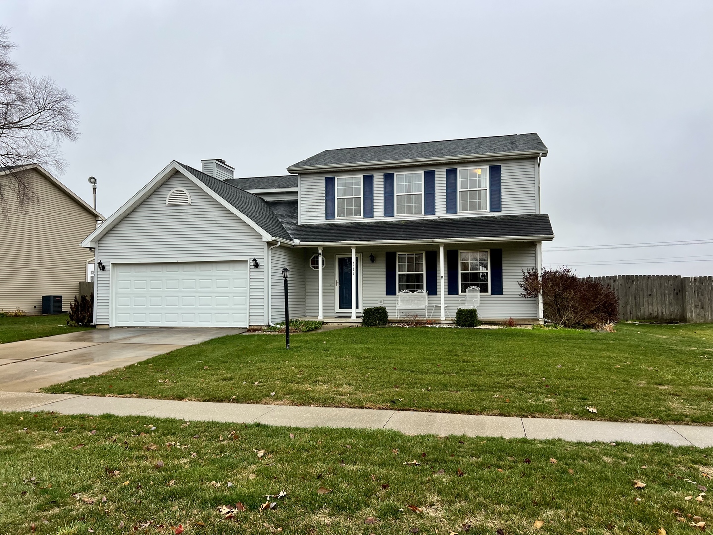a front view of a house with a yard and porch