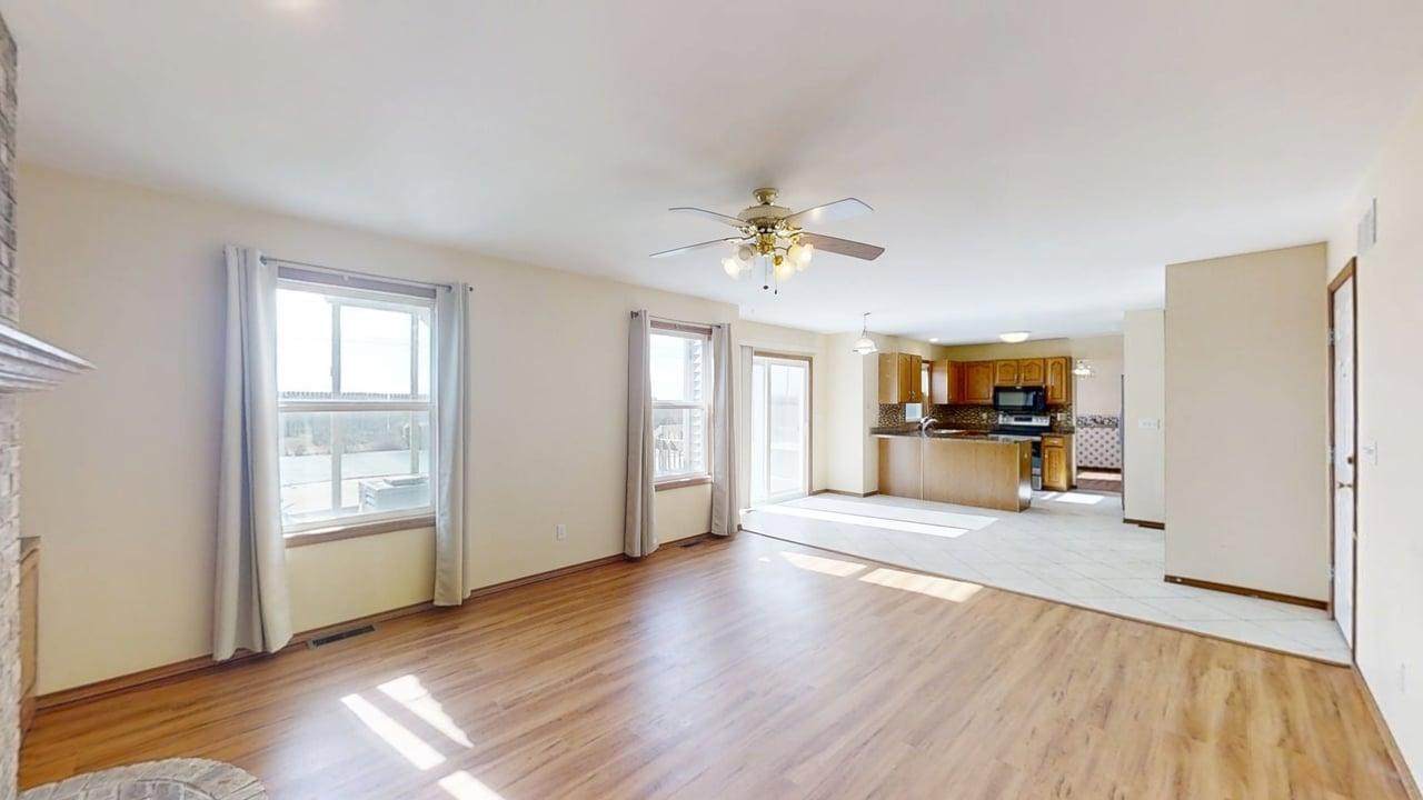 4511 Copper Ridge Road Champaign, IL 61822 - Photo 20 of 55 a view of an empty room with window and wooden floor