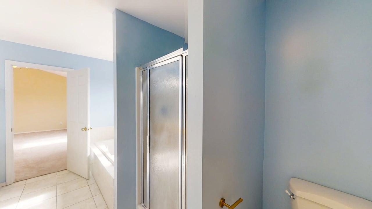 4511 Copper Ridge Road Champaign, IL 61822 - Photo 30 of 55 a bathroom with a glass door shower