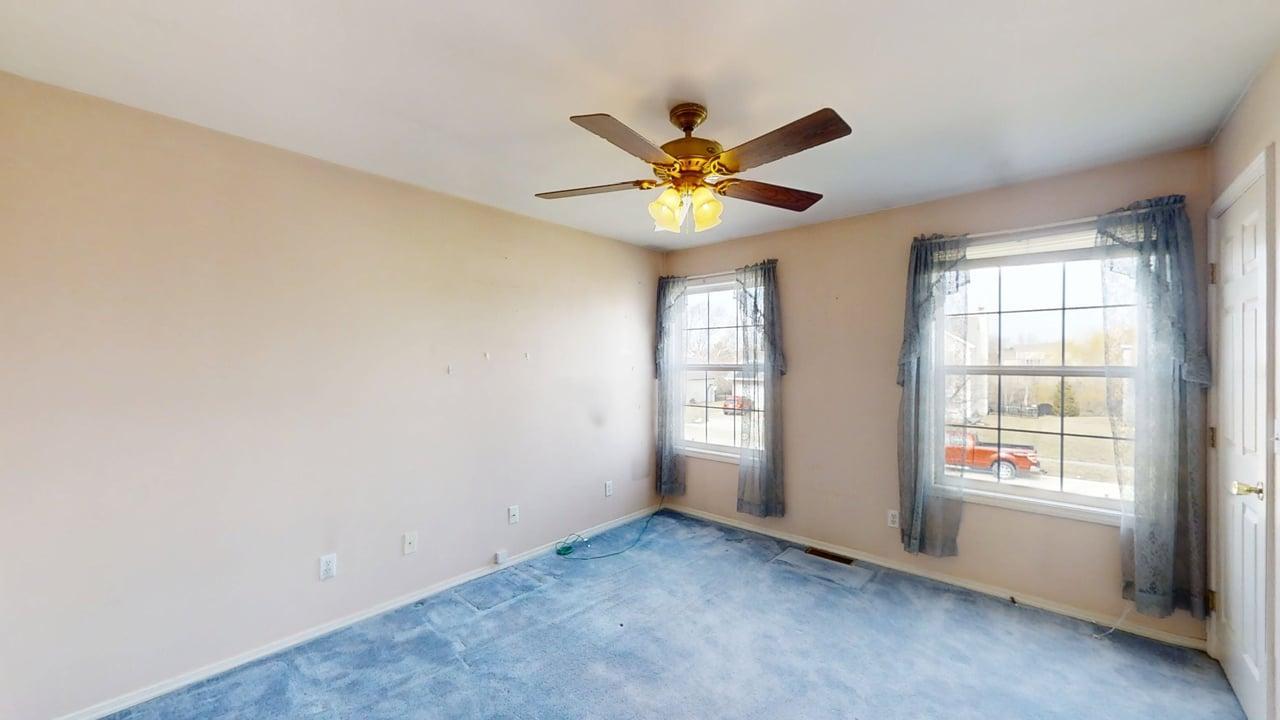 4511 Copper Ridge Road Champaign, IL 61822 - Photo 32 of 55 an empty room with windows and fan