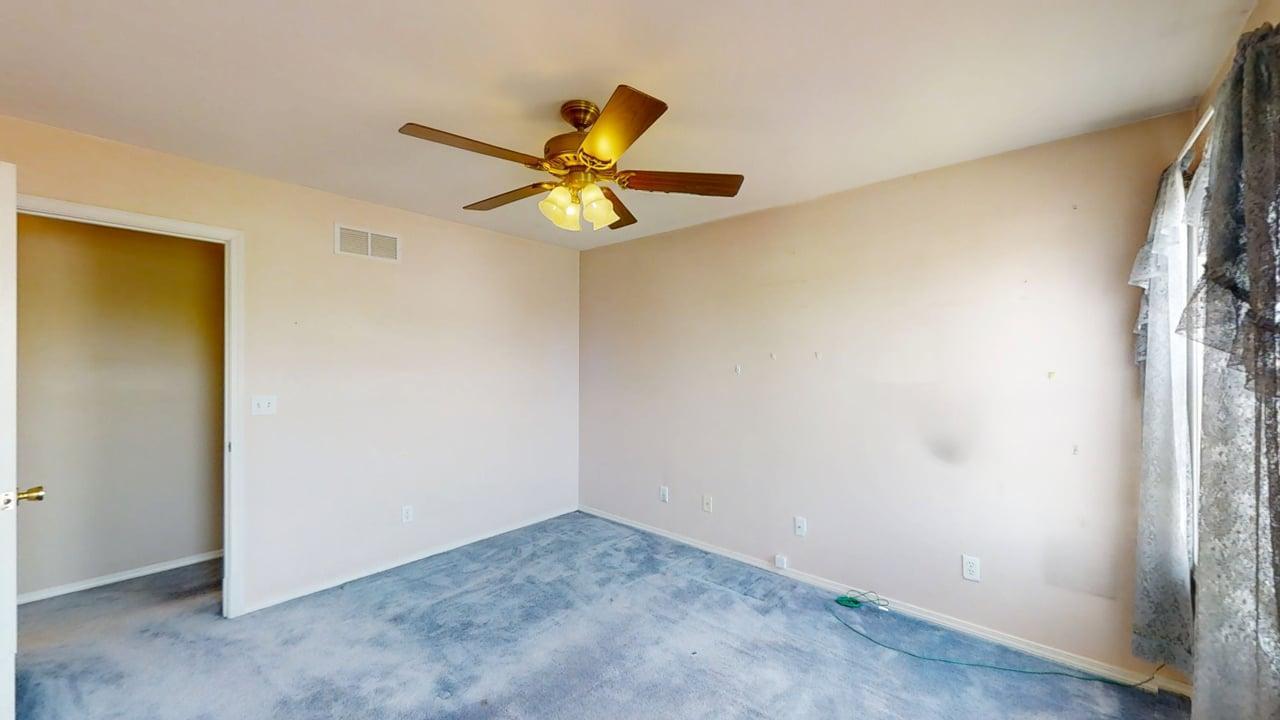 4511 Copper Ridge Road Champaign, IL 61822 - Photo 35 of 55 an empty room with a window and a fan