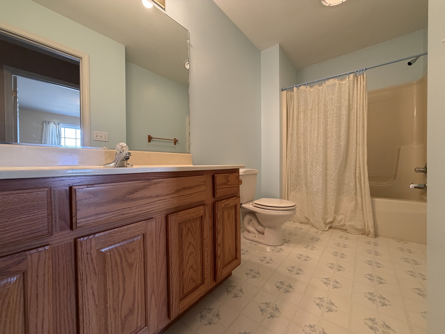 4511 Copper Ridge Road Champaign, IL 61822 - Photo 40 of 55 a spacious bathroom with a granite countertop sink a toilet and a mirror